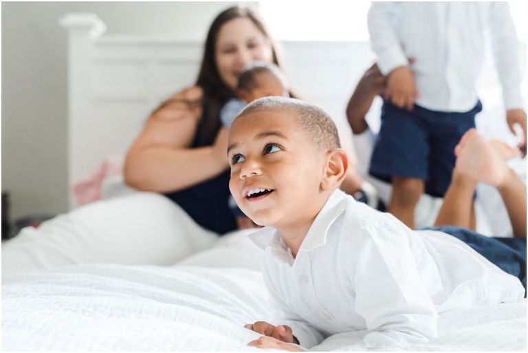 Candid photo of little boy at lifestyle newborn session in Pittsburgh