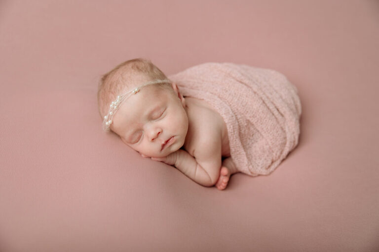 newborn girl on pink backdrop | Pittsburgh newborn photographers Kelly Adrienne Photography